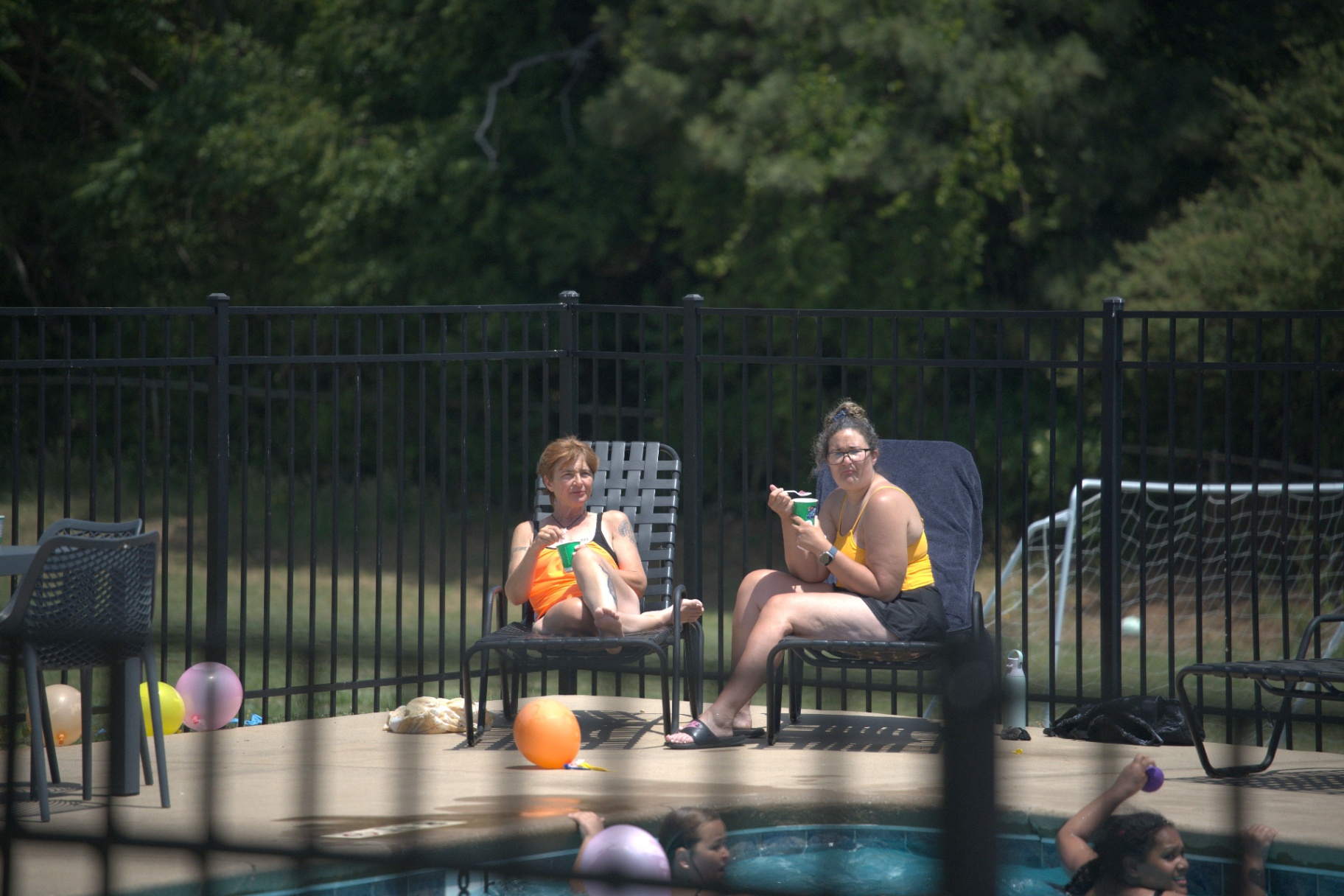 Neighbors enjoying snow cones poolside